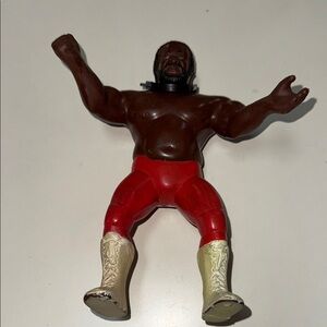 Titan Action Figure with Red Pants and Cream Boots
